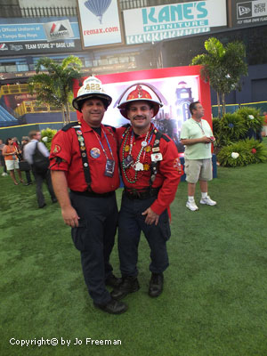 two men dress as patriotic firemen