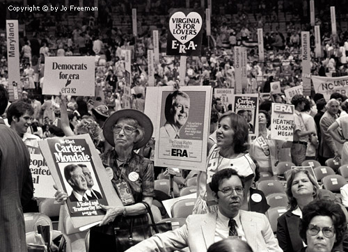 a large crowd shot reveals a crowd holding many pro-ERA posters alongside Carter posters
