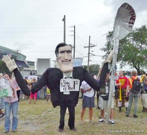 a Romney costume, complete with a King of the 1% sign
