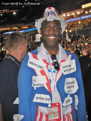 A man wears a red white and blue outfit with platform keywords pinned to it