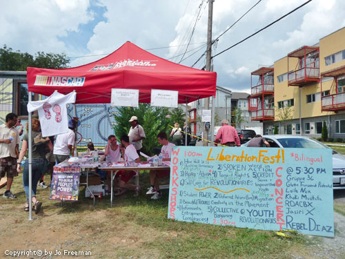 A festive table has a schedule board of workshops and concerts