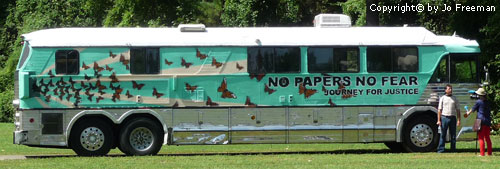 a tour bus reads No Papers no Fear