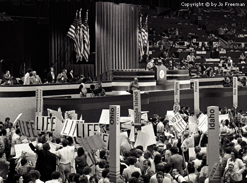 A sea of "Life" signs dominate an overhead shot of the crowd