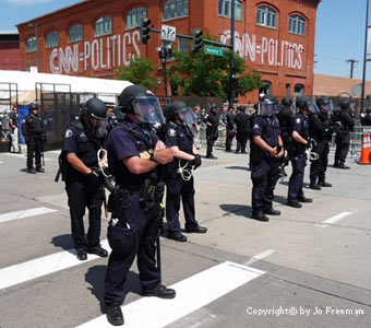 Police guard entrance to Pepsi Center