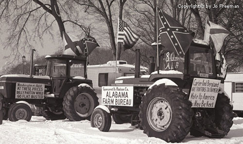 Tractors display momre american flags, confederate flags, and political signs