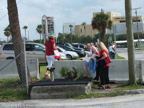 protestors by concrete barriers