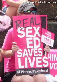 sign reading real sex ed saves lives, planned parenthood