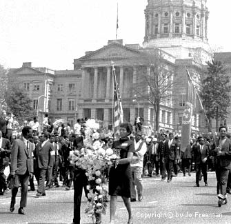 Funeral procession passing the state capitol