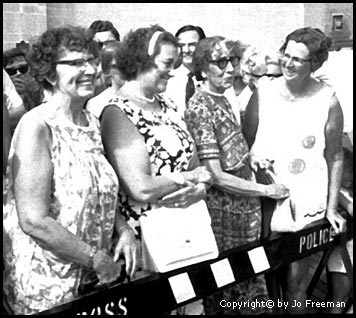 Female spectators respond to the skit.