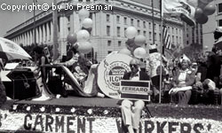 a parade float for the garment workers, one person holds a sign reading Ferraro