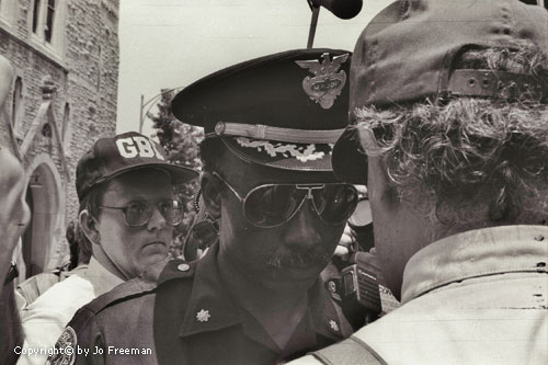 a black policeman speaks with Richard Barrett