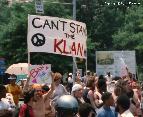 a sign reads can't stand the Klan