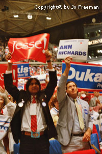 a native american holds a Jesse sign