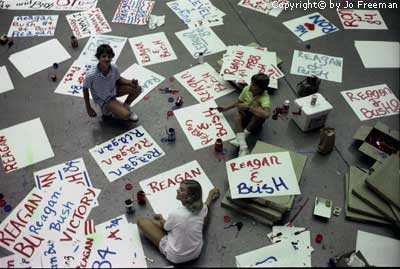 Volunteers paint signs to be displayed at appropriate moments