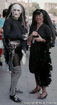 two people dressed as flamboyent nuns smile for the camera