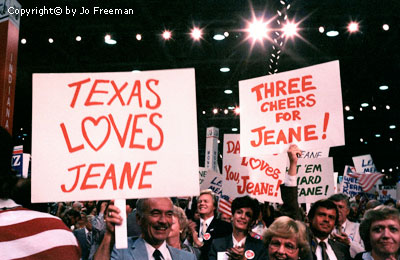 People holding signs reading texas loves Jeane and three cheers for Jeane