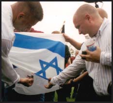 Neo-Nazis set fire to an Israeli flag